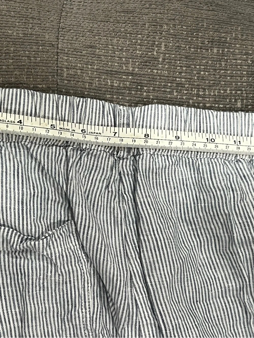Quince 100% European Linen Tapered Ankle Pants in the Blue Pinstripe pattern.